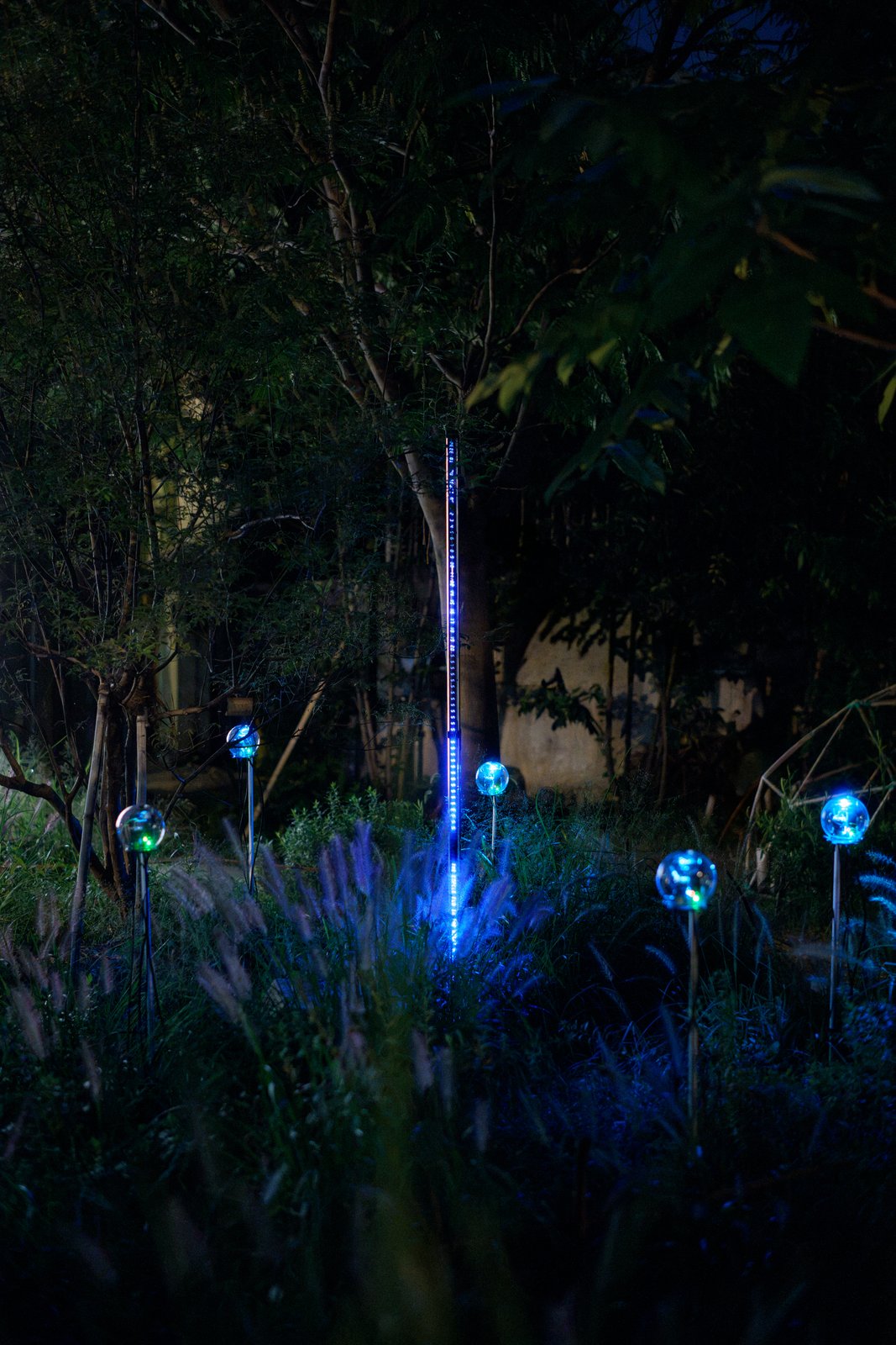 Botanical Intelligence: Moon Edition — LED bar with devices in the grass
